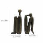 Buchstütze aus Kunstharz, beschwerte Figur in skulpturaler Form