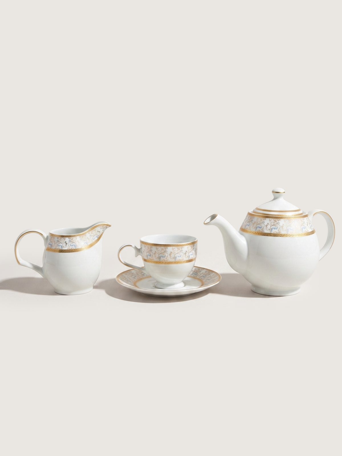 Teekanne aus Porzellan mit Milchkännchen und floralem Golddekor - Ansicht 7